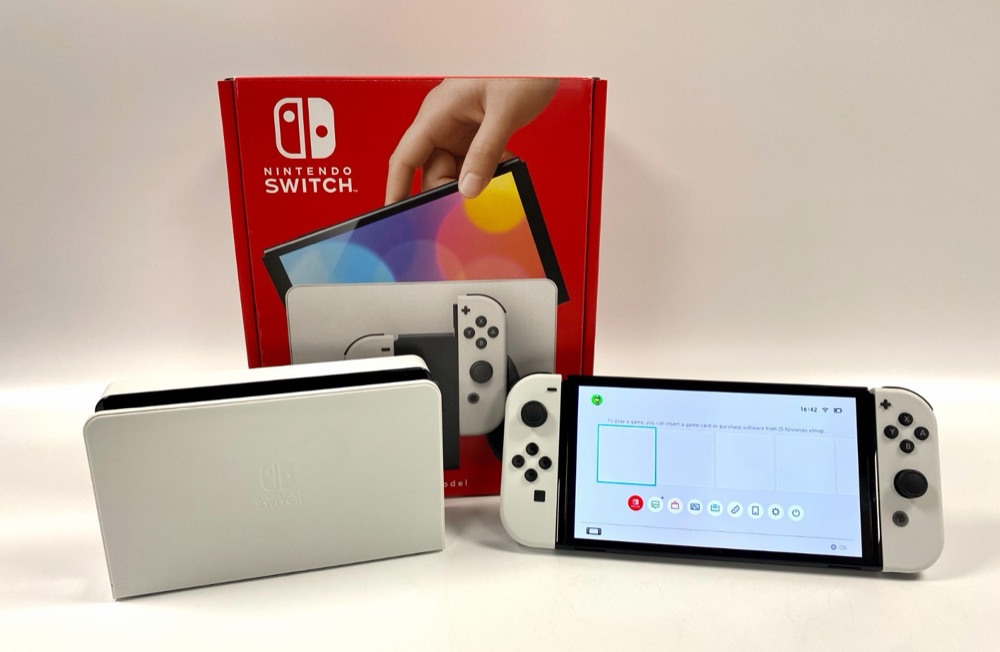 The console in its box with the dock
